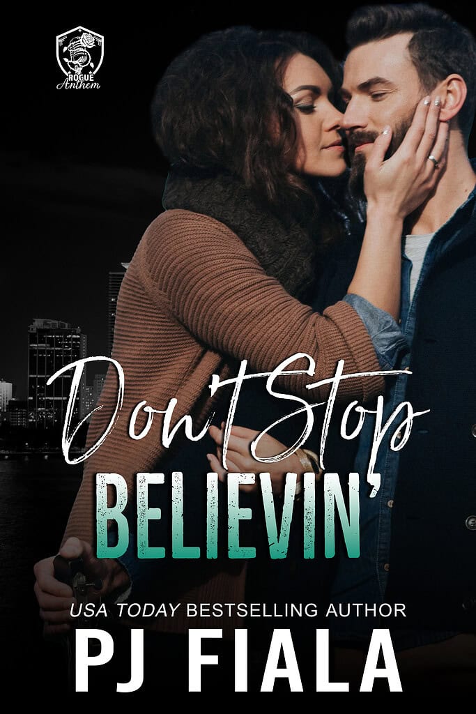 Front cover of Don't Stop Believin' by PJ Fiala. A dark-haired woman gently cups a bearded man's face as they lean together in a romantic embrace against a nighttime city skyline. Book One in the Blossom Springs: Rogue Anthem series.