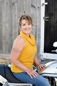 Photo of Romance Author PJ Fiala on a motorcycle